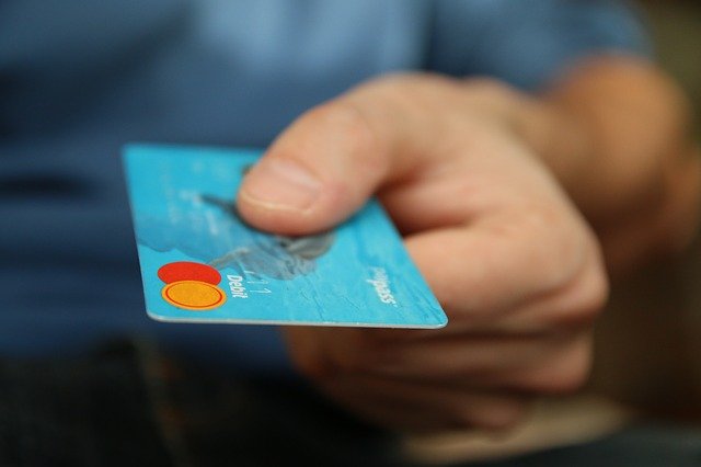 close up of someone holding a bank card