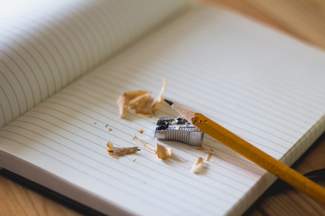 pencil and pencil shavings on a notebook