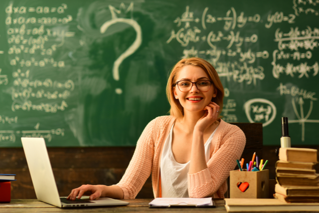 SmilingTeacherChalkboard